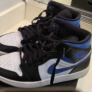 Air Jordan 1 Mid Black and White Sneakers with Blue Highlights